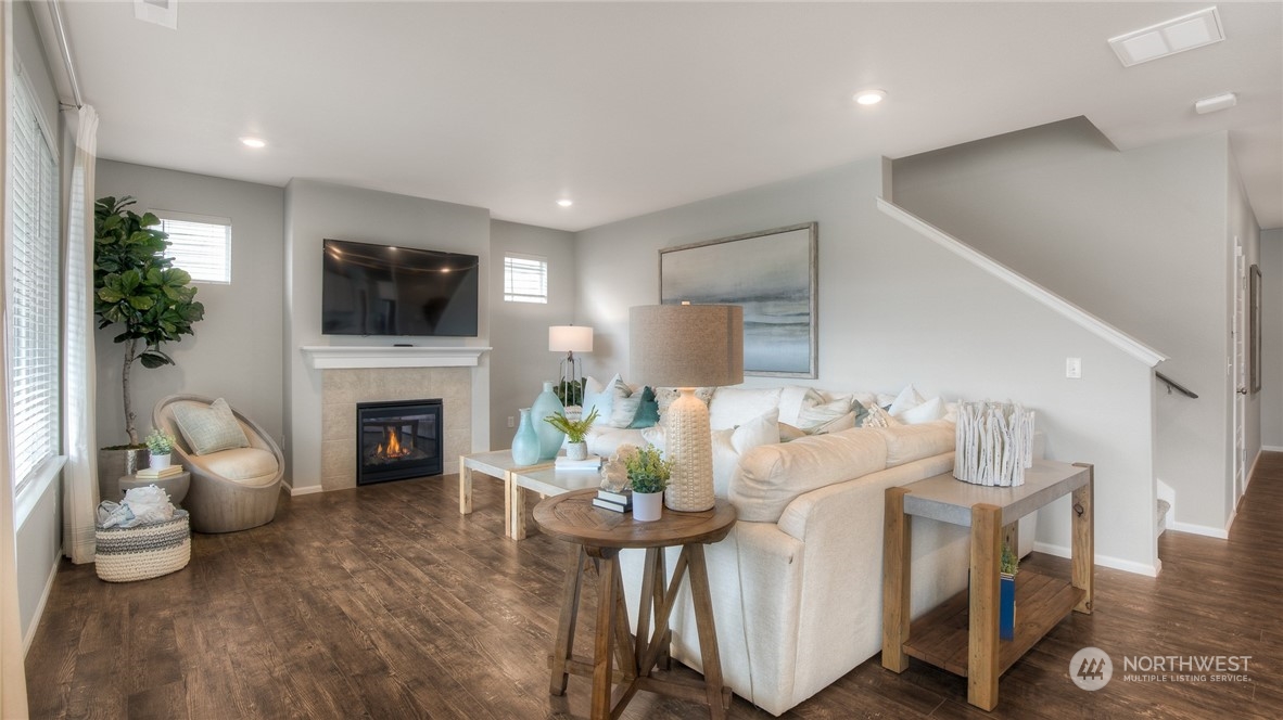 1323 Baker Hts Loop Bremerton, WA 98312 - Photo 3 of 18 a living room with furniture a fireplace and a flat screen tv