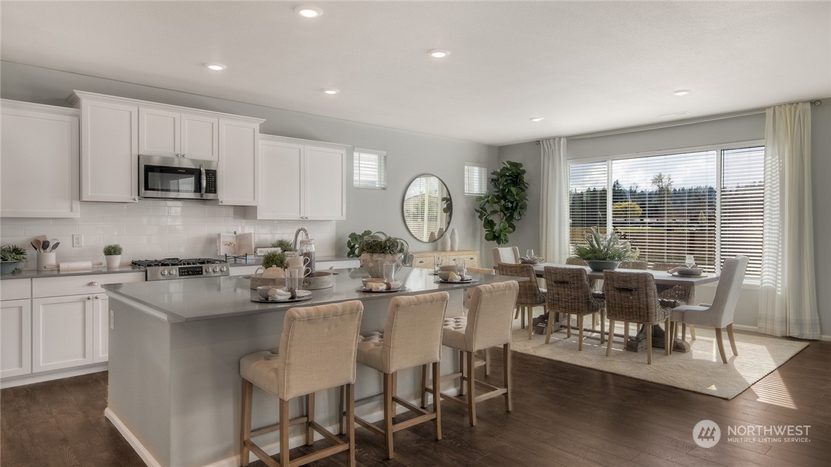 1323 Baker Hts Loop Bremerton, WA 98312 - Photo 4 of 18 a view of a dining room with furniture window and outside view