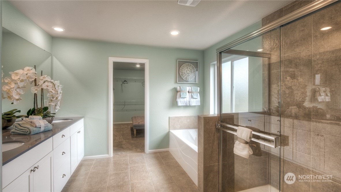 1323 Baker Hts Loop Bremerton, WA 98312 - Photo 9 of 18 a spacious bathroom with a double vanity sink a mirror and a shower