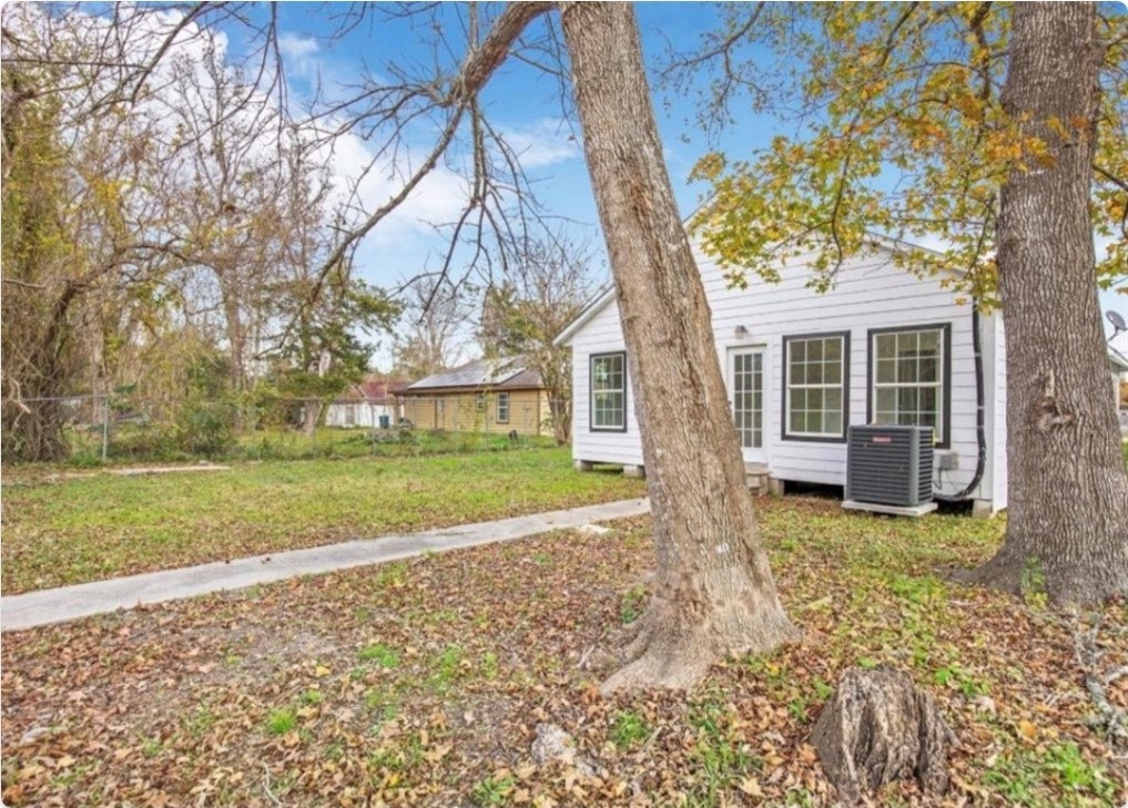 116 Trahan Street Ames, TX 77575 - Photo 23 of 23 a view of a house with backyard and trees