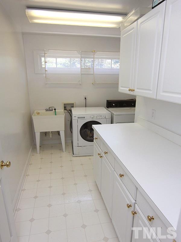 2705 Amstel Way Raleigh, NC 27613 - Photo 12 of 25 a kitchen with a cabinets and window