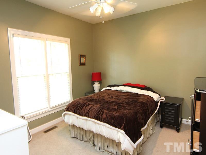 2705 Amstel Way Raleigh, NC 27613 - Photo 17 of 25 a bedroom with a bed and a window