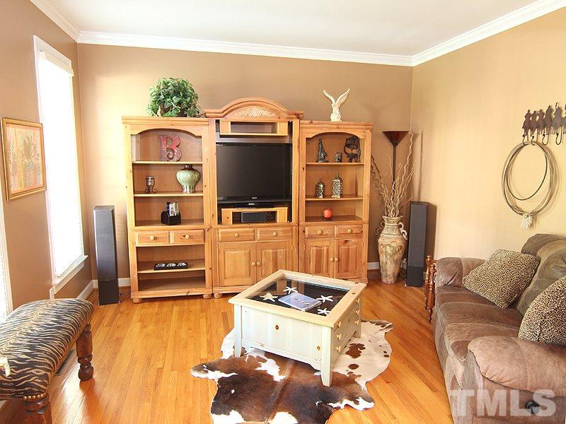 2705 Amstel Way Raleigh, NC 27613 - Photo 5 of 25 a living room with furniture and a flat screen tv