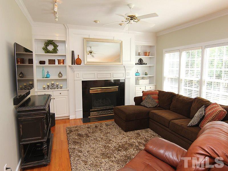 2705 Amstel Way Raleigh, NC 27613 - Photo 7 of 25 a living room with furniture and a fireplace
