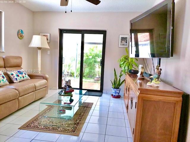 6527 West 22nd Lane Hialeah, FL 33016 - Photo 3 of 18 a living room with furniture and a lamp