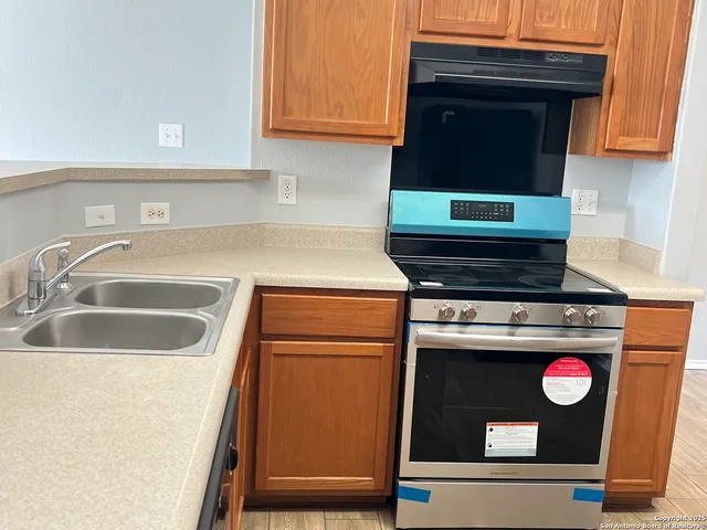 a kitchen with a stove and a microwave