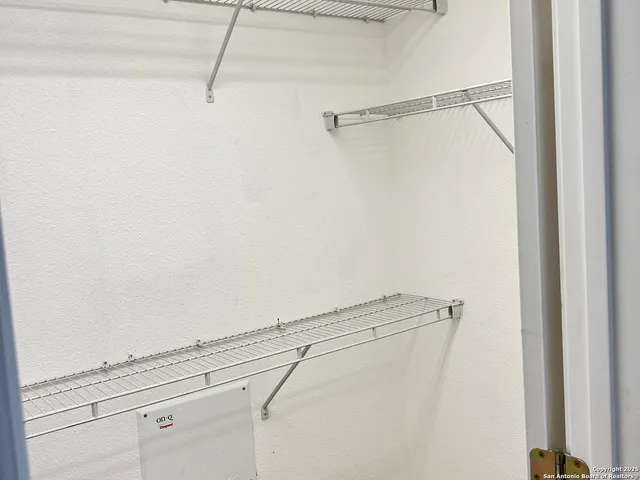 a view of a room with racks on the wall
