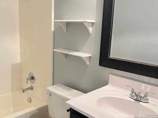 a bathroom with a sink and a bathtub