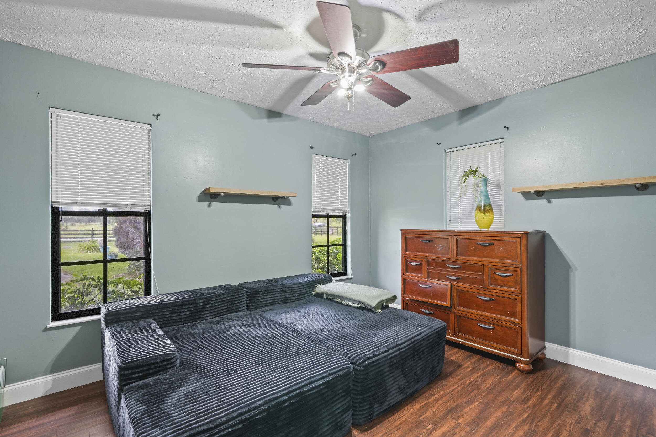 4170 McCarty Road Fort Pierce, FL 34945 - Photo 27 of 57 a bedroom with a bed and furniture