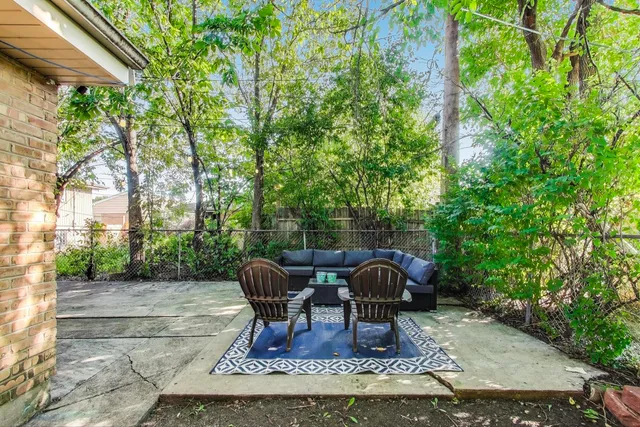a view of outdoor sitting area with furniture