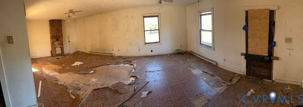 1675 Meadow Road Sandston, VA 23150 - Photo 8 of 22 an empty room with wooden floor and windows
