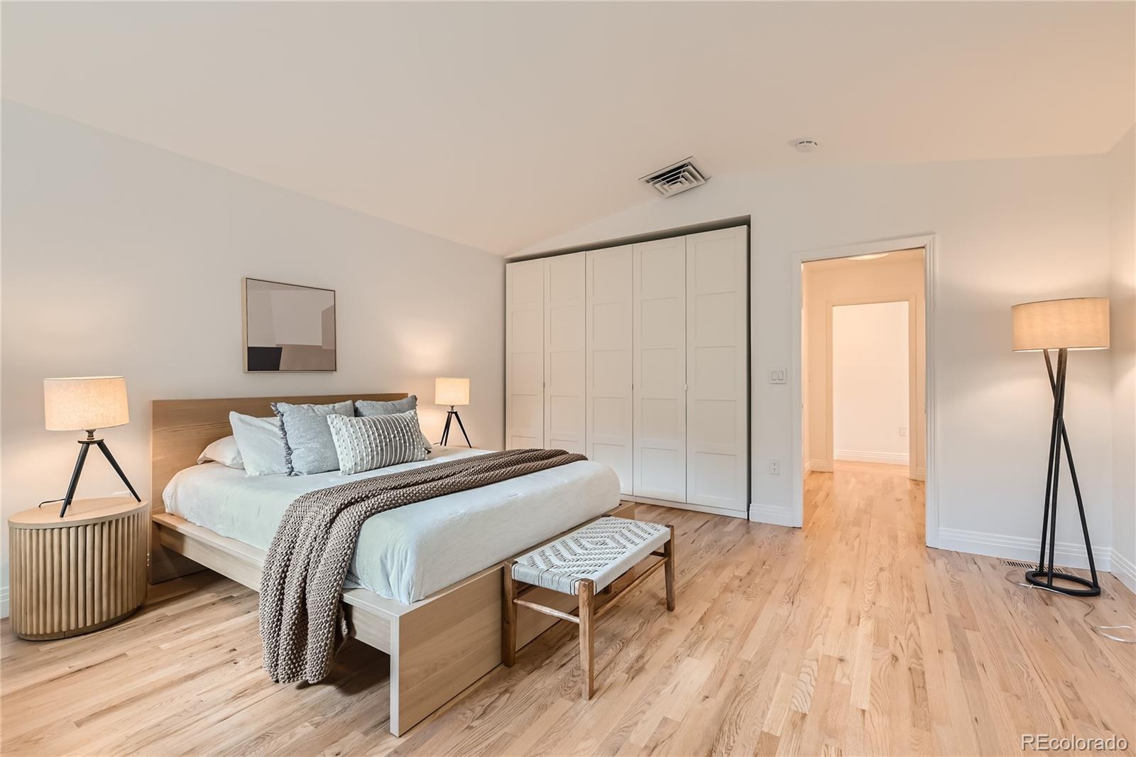 265 30th Street Boulder, CO 80305 - Photo 15 of 25 a bedroom with a bed and a wooden floor