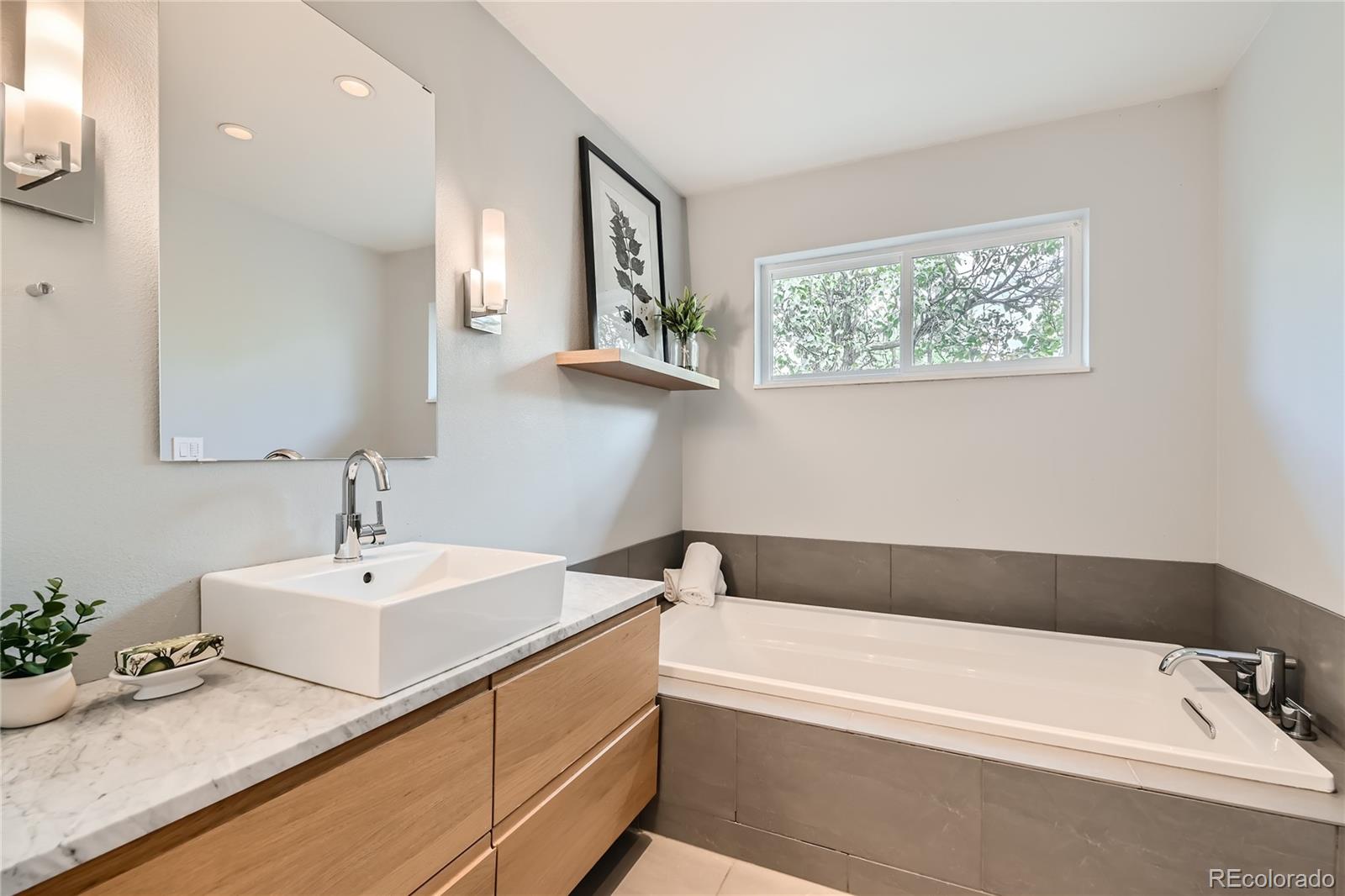 265 30th Street Boulder, CO 80305 - Photo 16 of 25 a bathroom with a bathtub and a sink