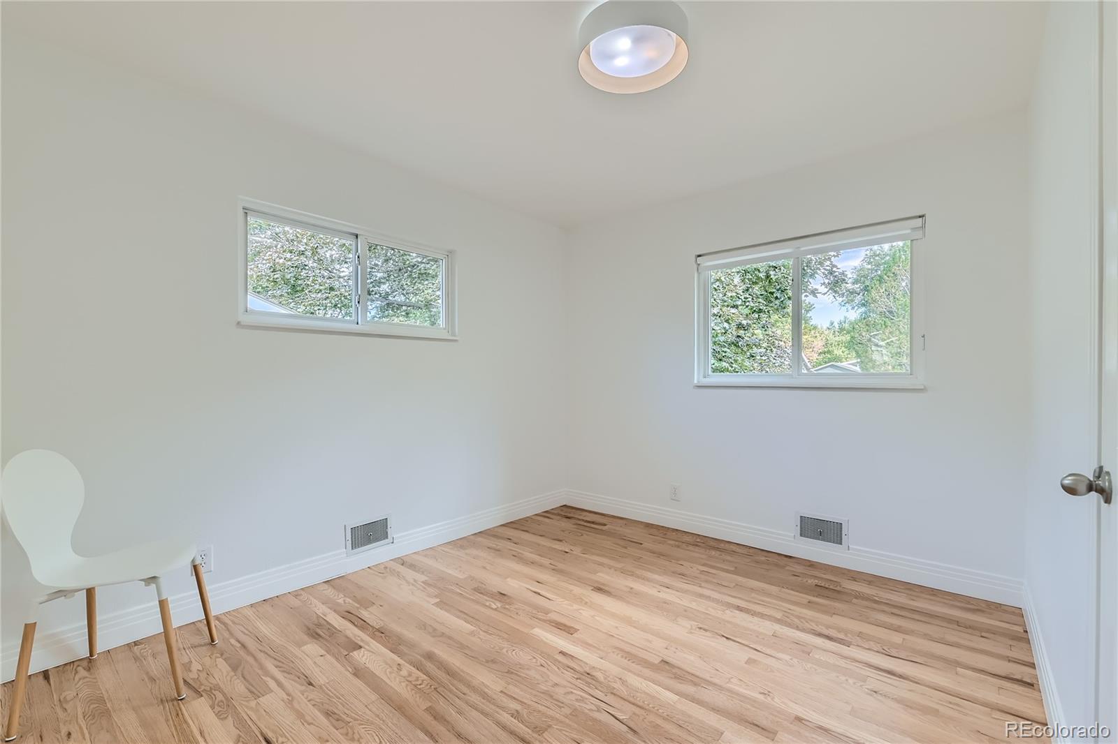 265 30th Street Boulder, CO 80305 - Photo 22 of 25 a view of a room with wooden floor and window