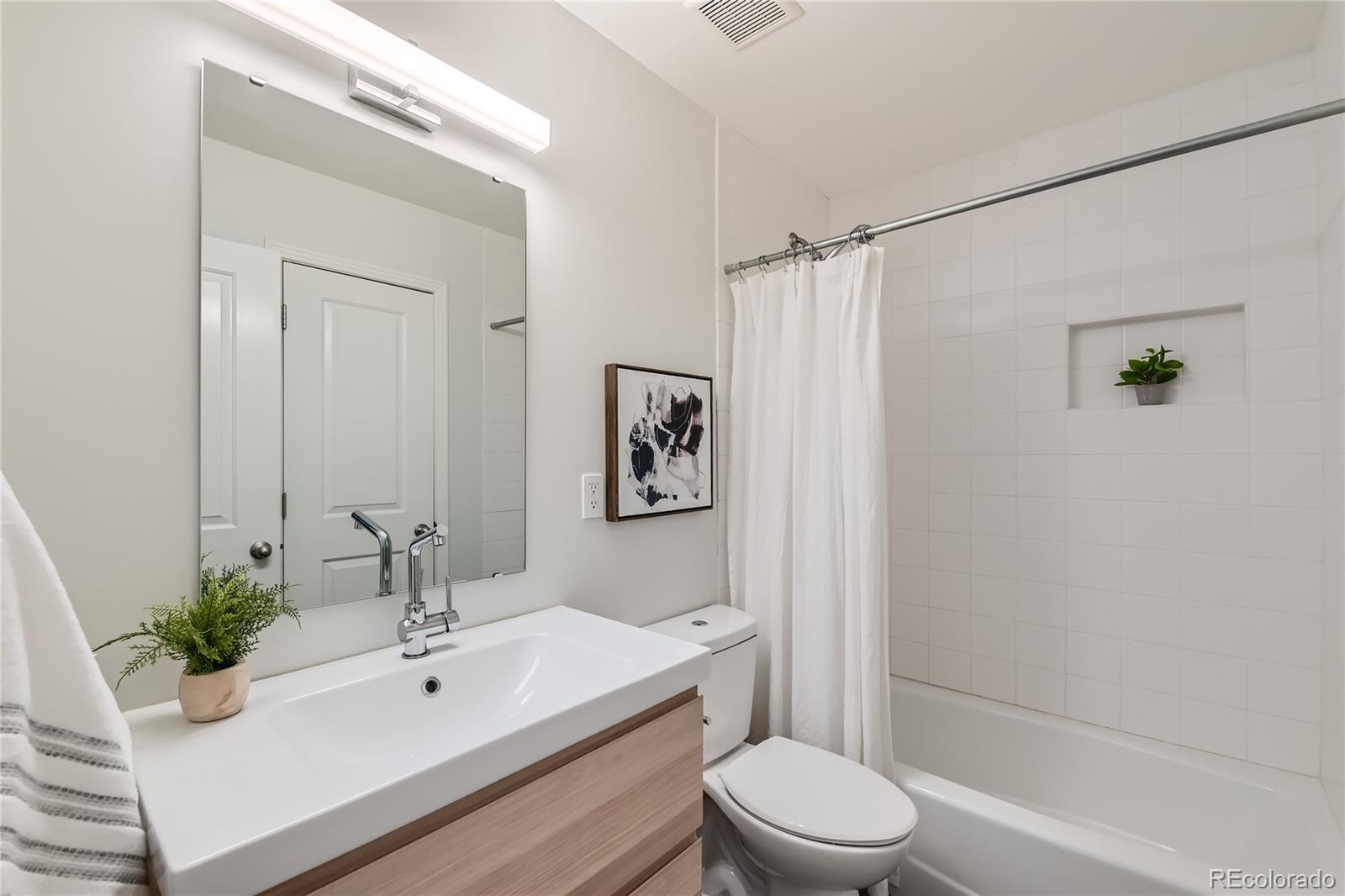 265 30th Street Boulder, CO 80305 - Photo 23 of 25 a bathroom with a sink a toilet and shower