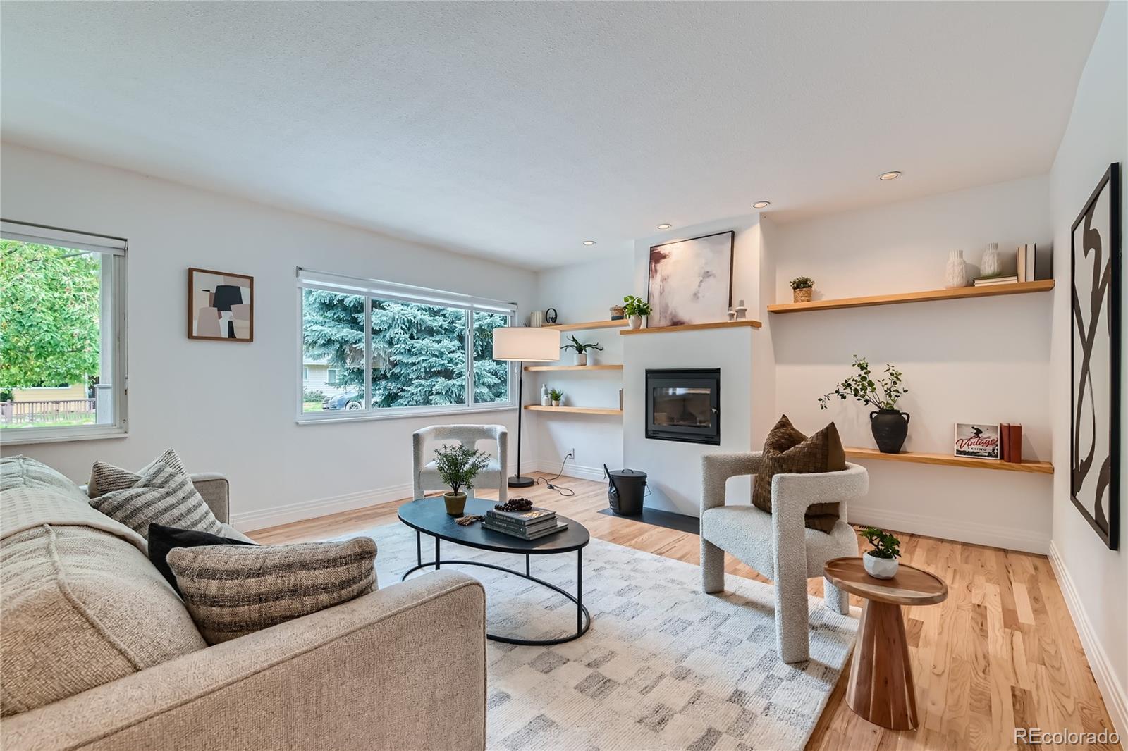 265 30th Street Boulder, CO 80305 - Photo 4 of 25 a living room with furniture fireplace and a window