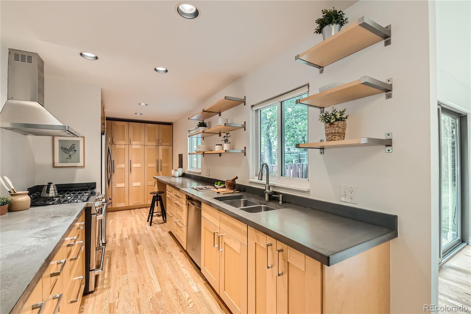 265 30th Street Boulder, CO 80305 - Photo 9 of 25 a kitchen with a sink a stove and a refrigerator