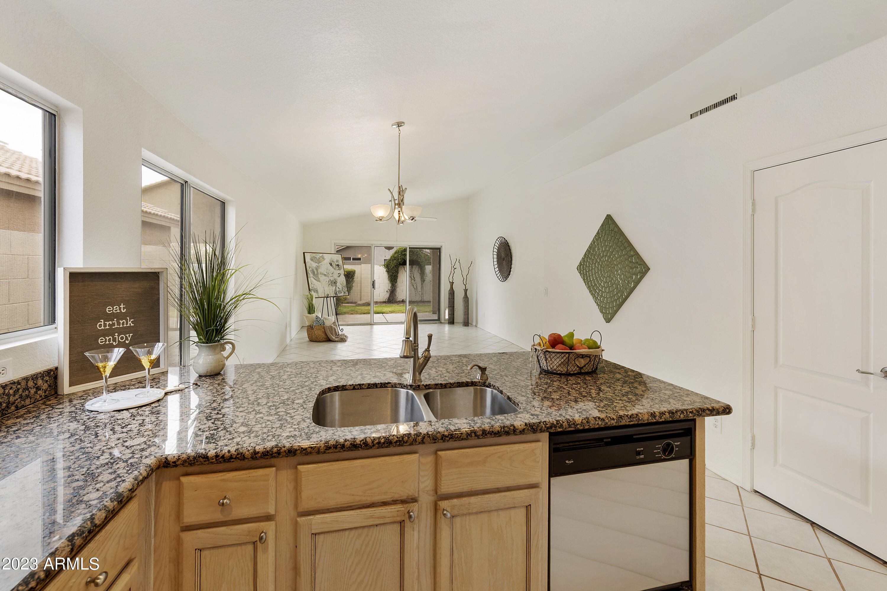 167 West Smoke Tree Road Gilbert, AZ 85233 - Photo 8 of 31 a kitchen with stainless steel appliances granite countertop a sink and a refrigerator