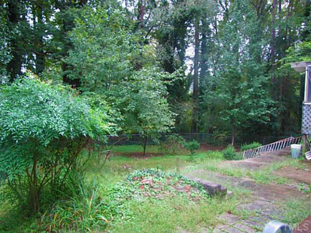745 St George Road Raleigh, NC 27610 - Photo 8 of 8 a view of a lake with a tree