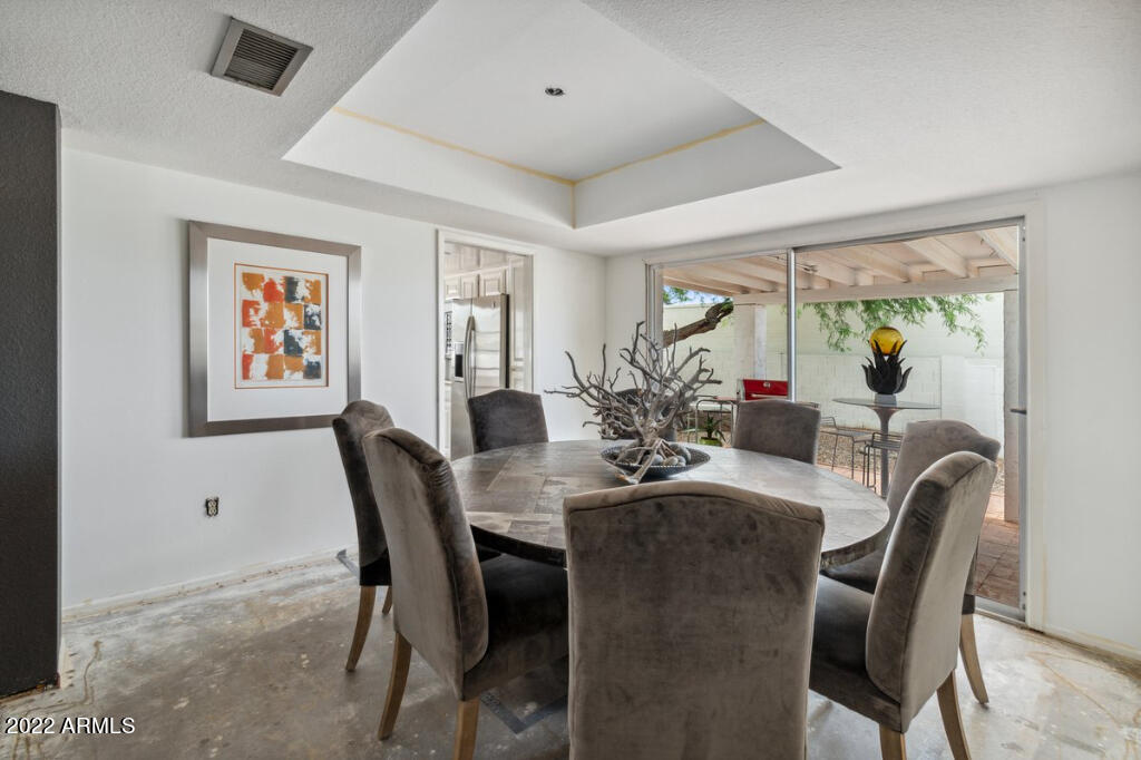 525 East Calavar Road Phoenix, AZ 85022 - Photo 8 of 25 a view of a dining room with furniture window and outside view