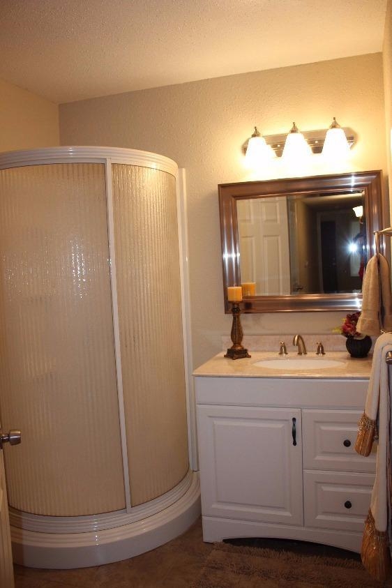 1133 D Street Reedley, CA 93654 - Photo 8 of 10 a bathroom with a sink and a mirror