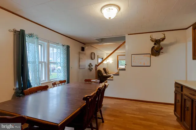 a view of a livingroom with furniture and wooden floor