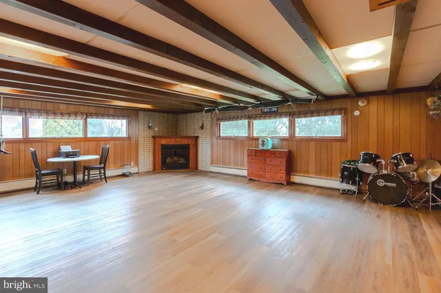 a living room with furniture and wooden floors
