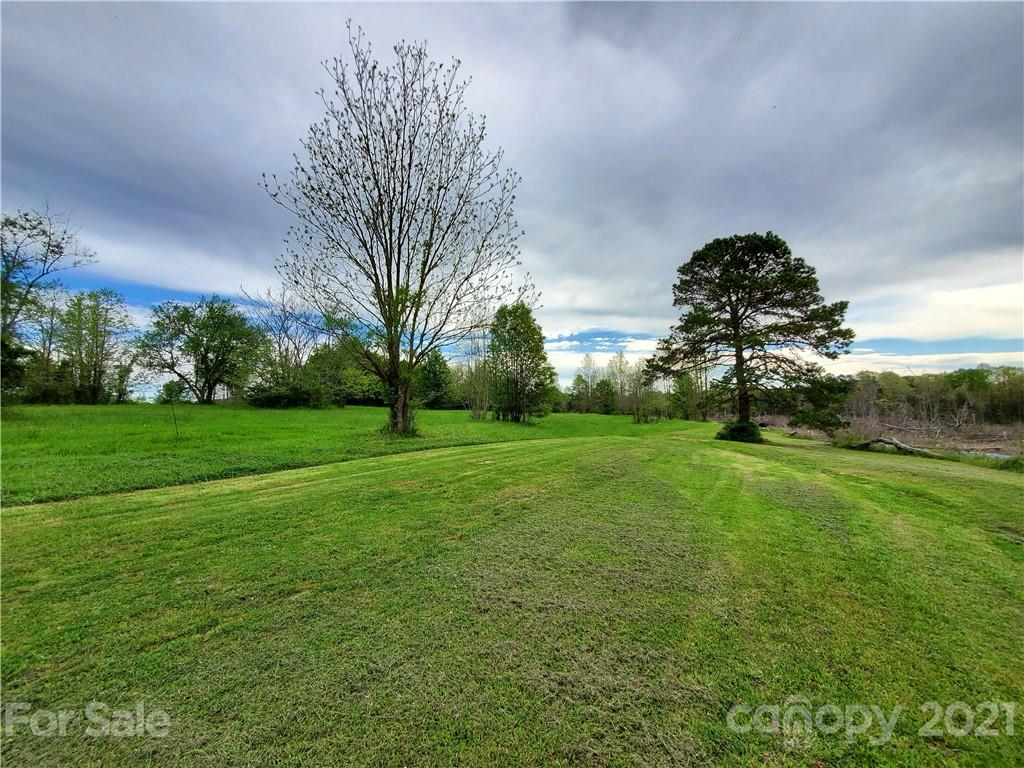 16.104 Ruben Road, Unit 2713 Monroe, NC 28112 - Photo 1 of 15 a backyard of a house with lots of green space