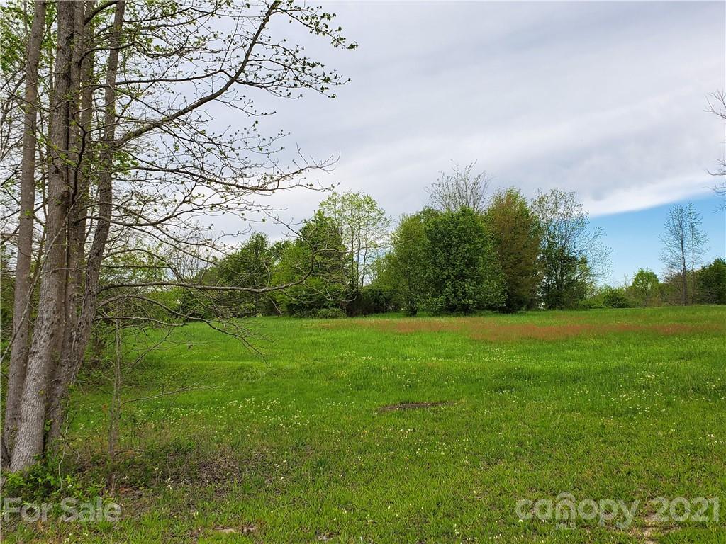 16.104 Ruben Road, Unit 2713 Monroe, NC 28112 - Photo 12 of 15 a view of field with trees in the background