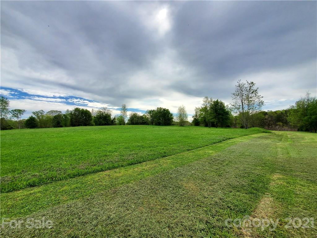 16.104 Ruben Road, Unit 2713 Monroe, NC 28112 - Photo 4 of 15 a view of field with green space