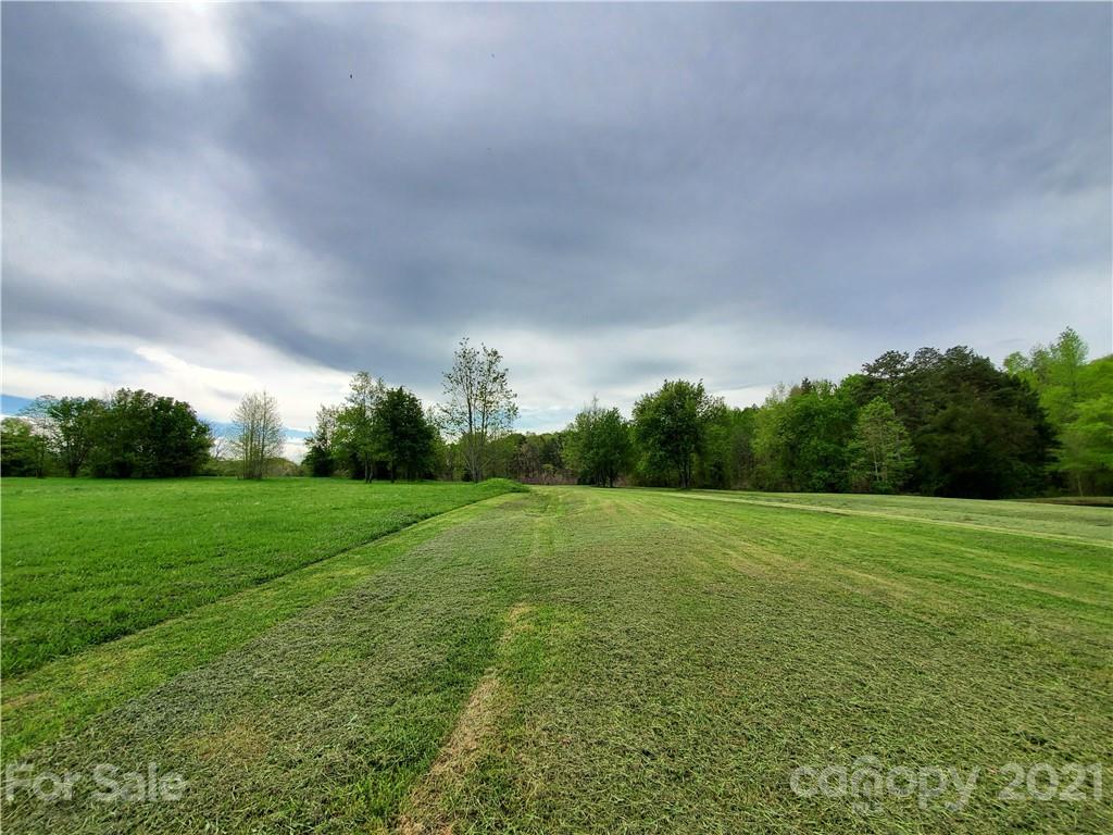 16.104 Ruben Road, Unit 2713 Monroe, NC 28112 - Photo 5 of 15 a view of field with grass and a trees