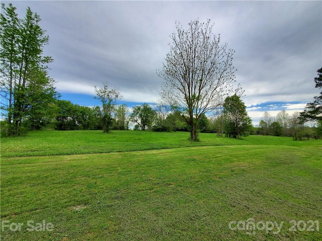 16.104 Ruben Road, Unit 2713 Monroe, NC 28112 - Photo 10 of 15 a view of field with trees in the background