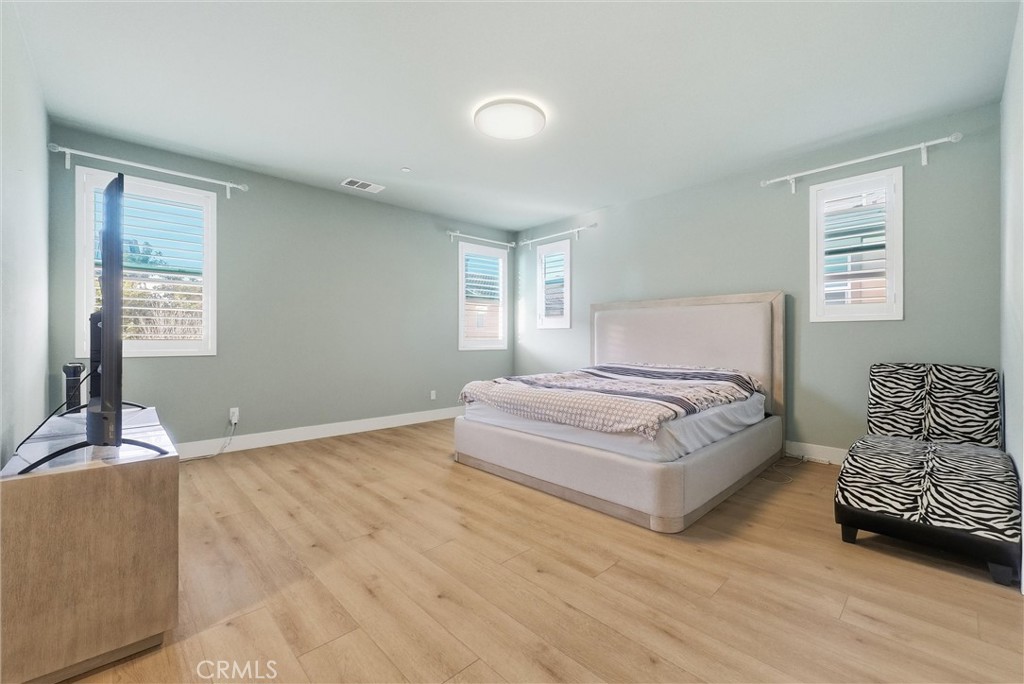 15828 Kingston Road Chino Hills, CA 91709 - Photo 16 of 33 a bedroom with a bed and window