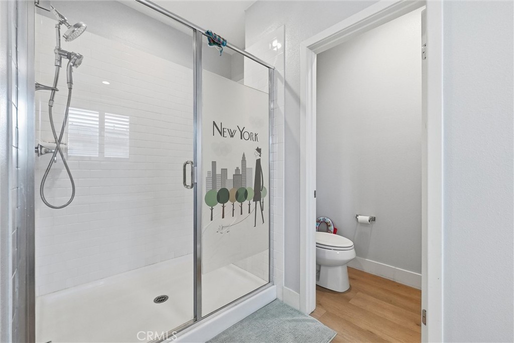 15828 Kingston Road Chino Hills, CA 91709 - Photo 19 of 33 a bathroom with a shower toilet and sink