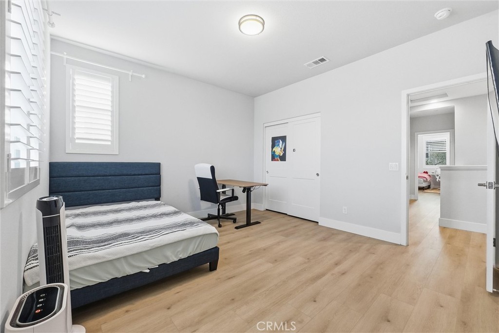 15828 Kingston Road Chino Hills, CA 91709 - Photo 23 of 33 a bedroom with a bed and a desk