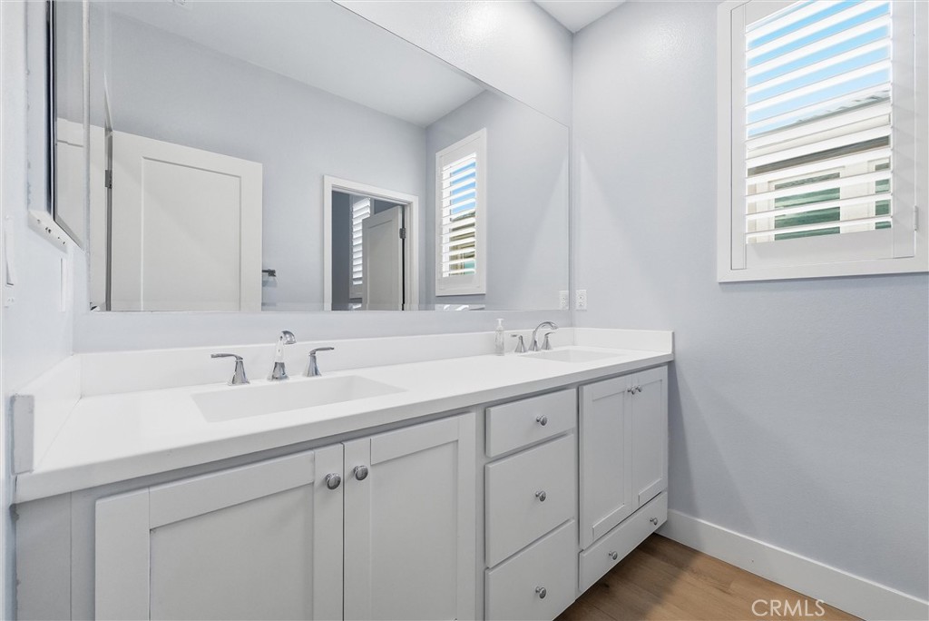 15828 Kingston Road Chino Hills, CA 91709 - Photo 24 of 33 a bathroom with a double vanity sink and mirror