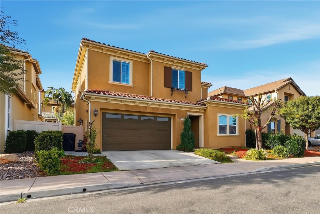 15828 Kingston Road Chino Hills, CA 91709 - Photo 33 of 33 a front view of a house with a yard and garage