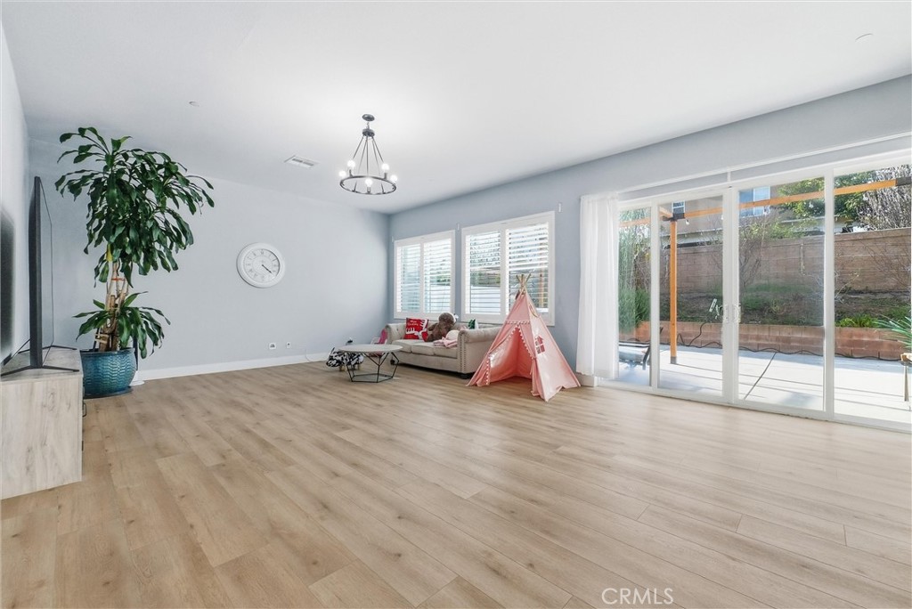 15828 Kingston Road Chino Hills, CA 91709 - Photo 4 of 33 a view of a room with gym equipment and a large window
