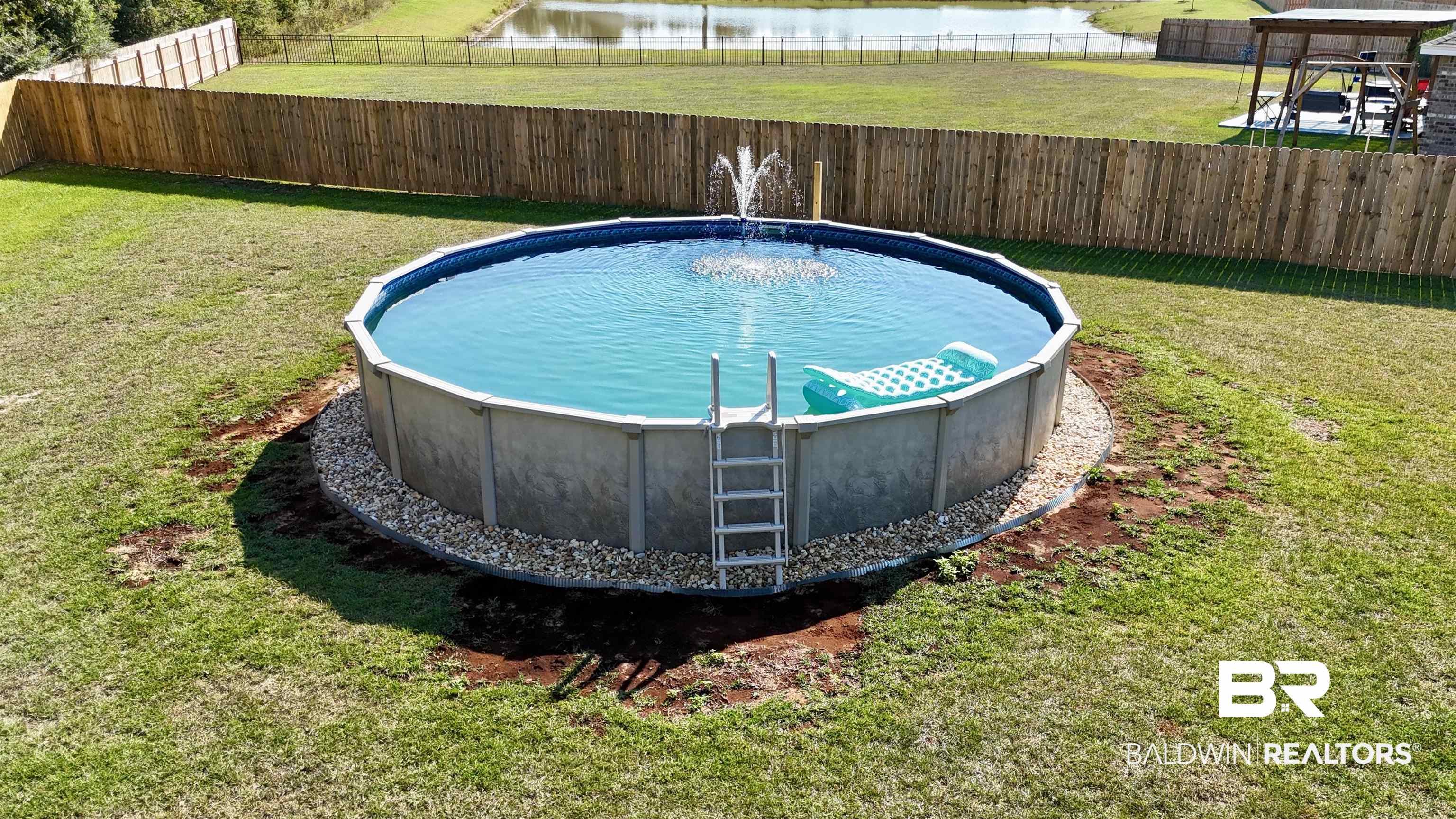 24216 Ringneck Loop Elberta, AL 36530 - Photo 6 of 23 View of swimming pool featuring a water view and a fenced backyard