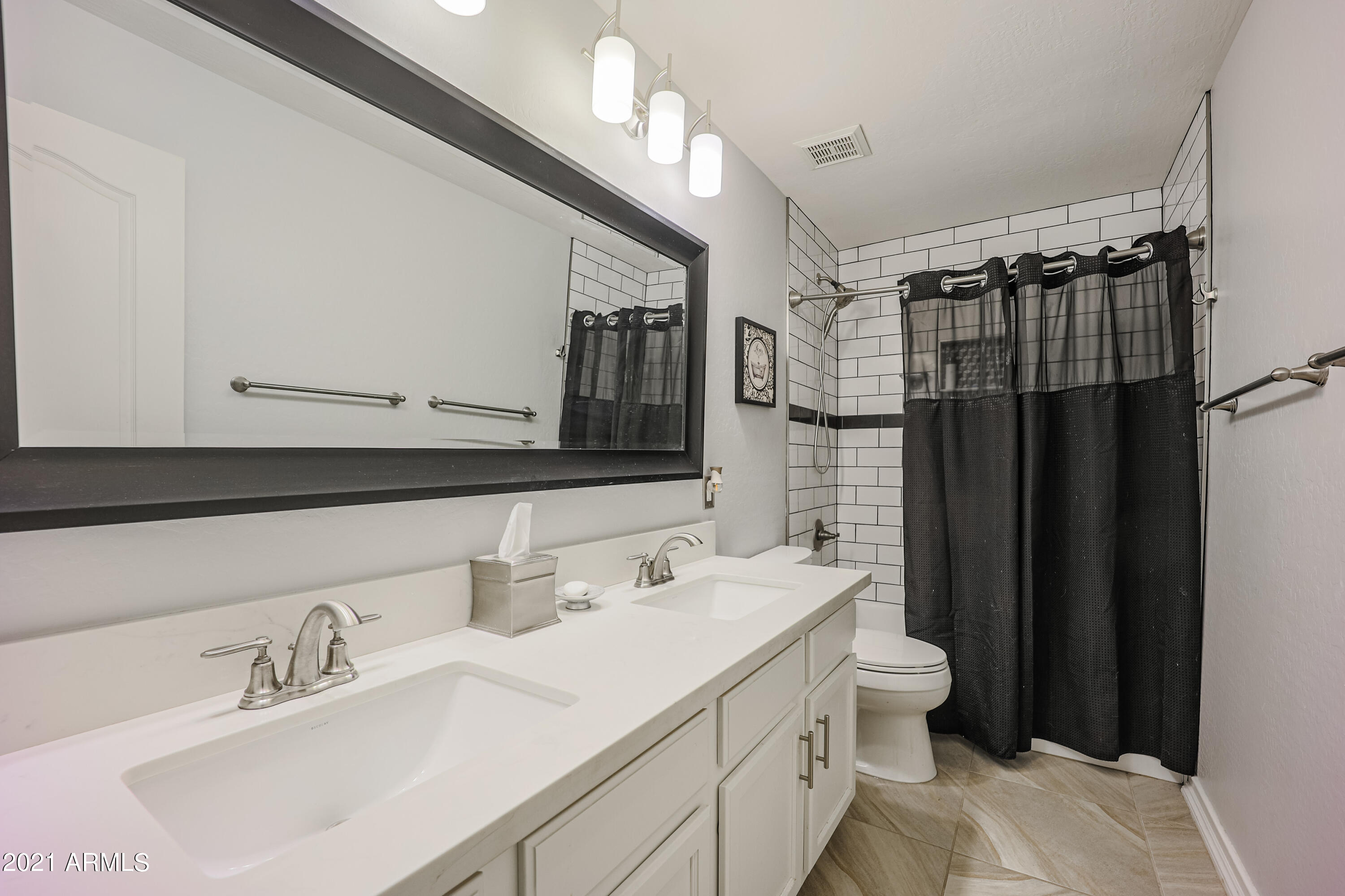 464 East Ranch Road Gilbert, AZ 85296 - Photo 9 of 21 a bathroom with a sink double vanity and a mirror
