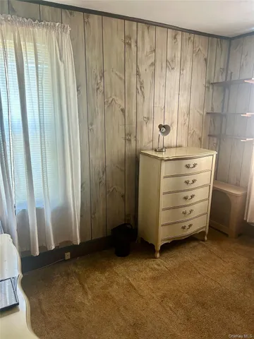 a view of walk in closet with clothes