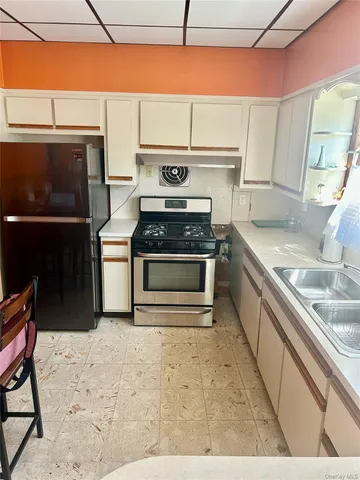 a kitchen with a stove and a microwave