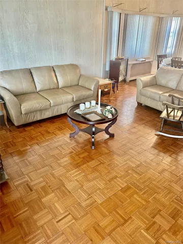 a living room with a couch and a rug