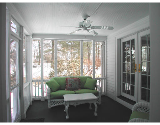 15 Old Colony Road Wellesley, MA 02481 - Photo 13 of 15 a living room with furniture and a floor to ceiling window