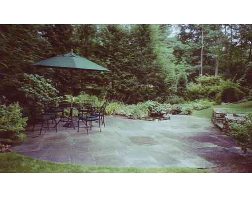 15 Old Colony Road Wellesley, MA 02481 - Photo 15 of 15 a backyard of a house with table and chairs
