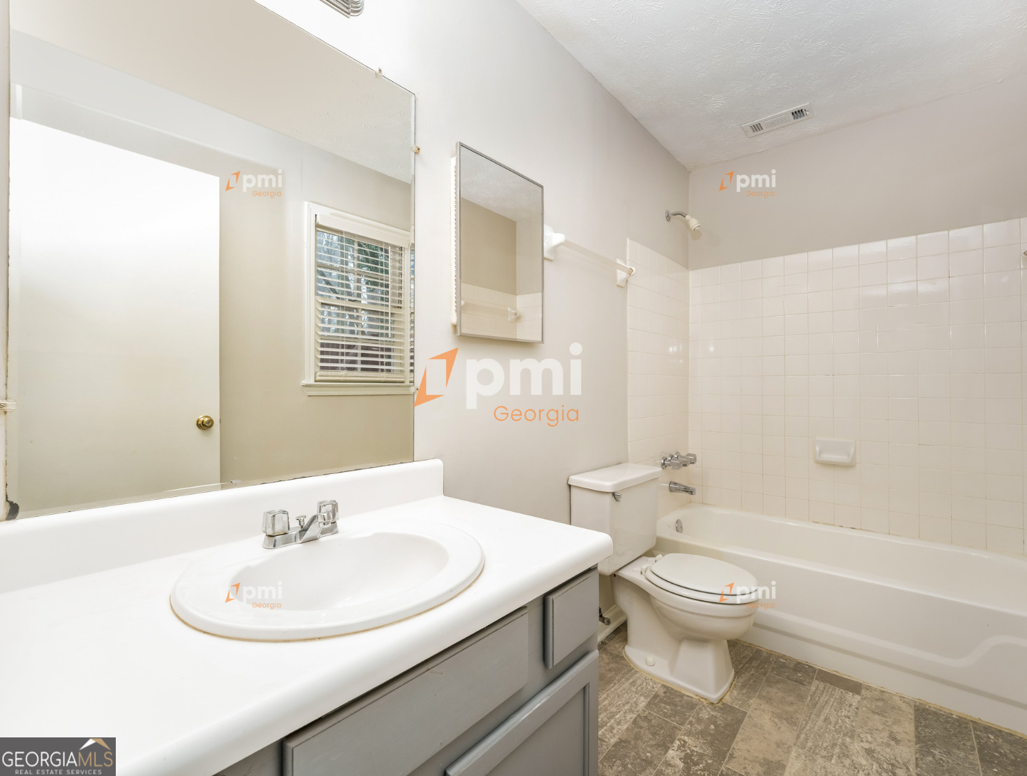 667 Rae Drive Southwest Lawrenceville, GA 30044 - Photo 13 of 19 a bathroom with a sink toilet tub and shower