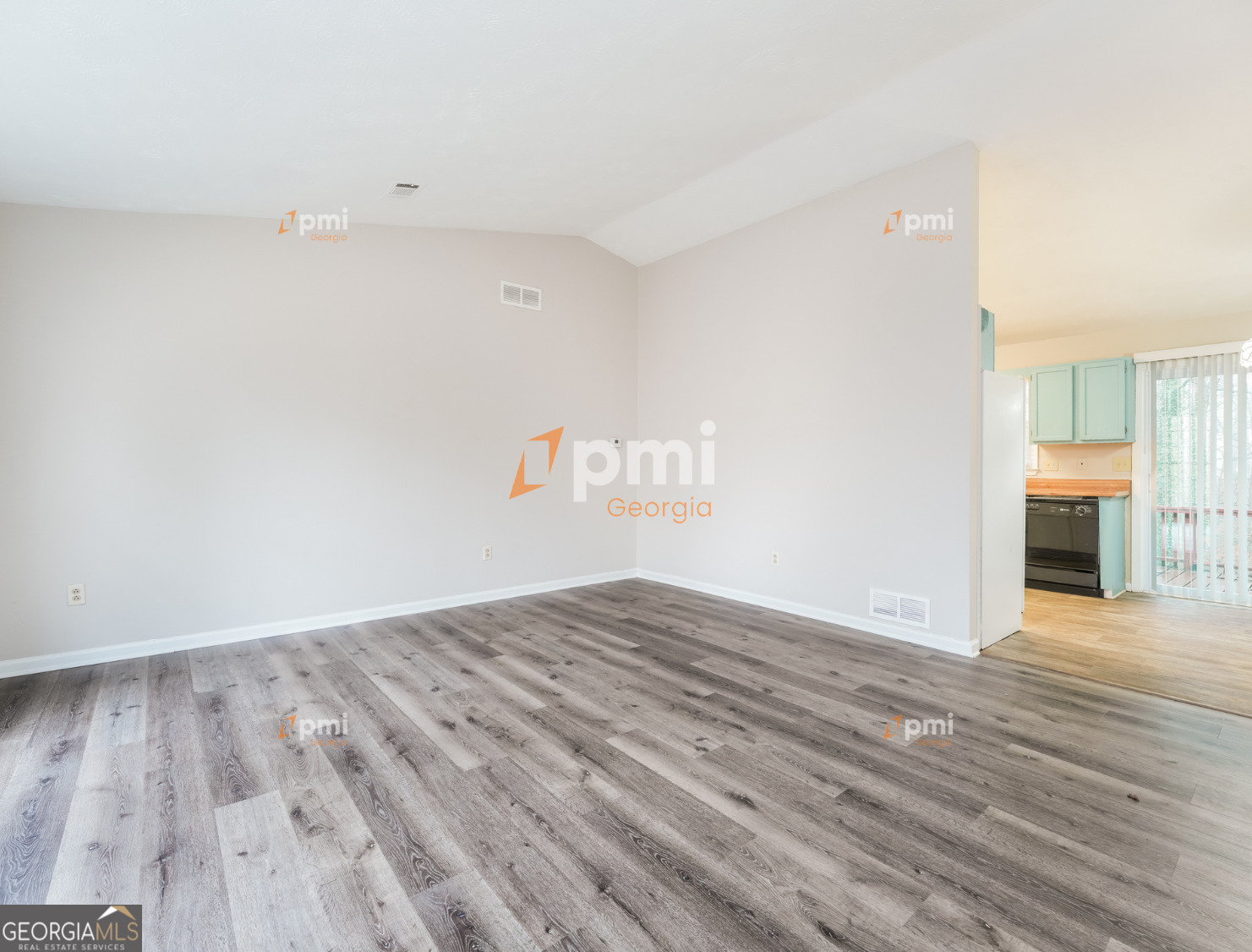 667 Rae Drive Southwest Lawrenceville, GA 30044 - Photo 5 of 19 a view of a livingroom with wooden floor
