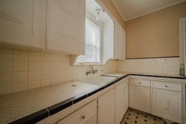 a kitchen with a sink and cabinets