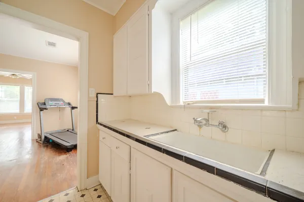 a view of a bathroom with a sink and a window