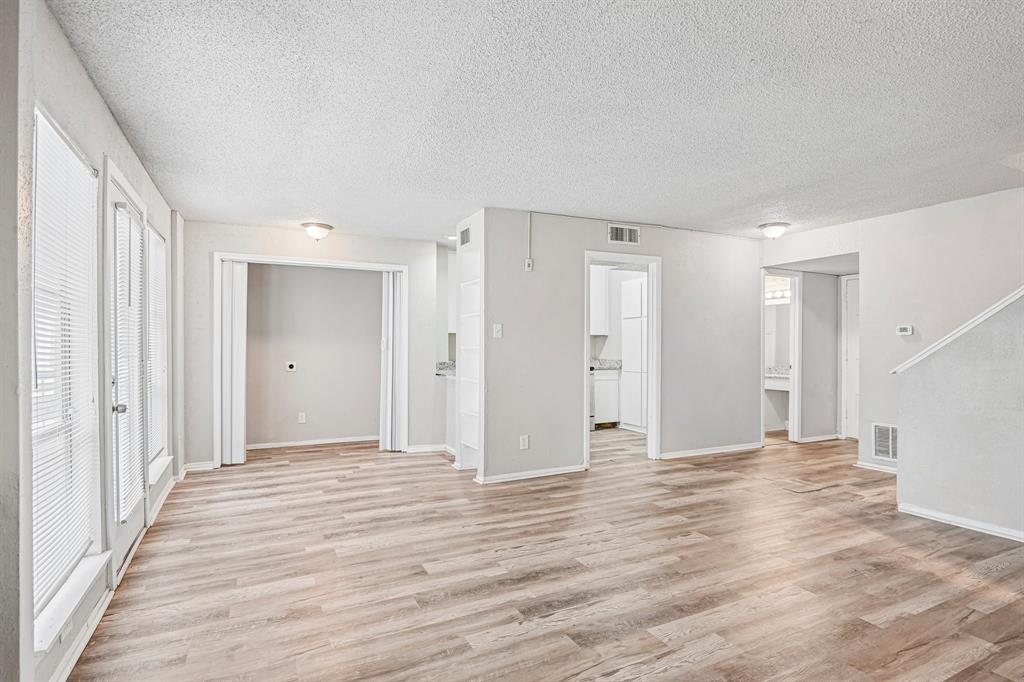 5534 Boca Raton Boulevard, Unit 292 Fort Worth, TX 76112 - Photo 6 of 31 a view of empty room with wooden floor